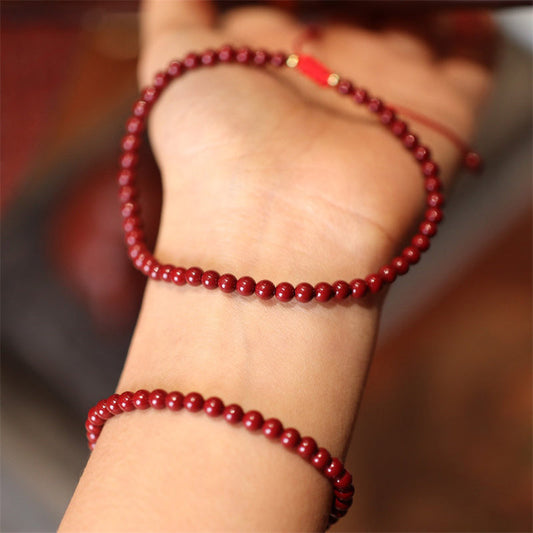 Alte tibetisch-buddhistische Tradition: Armband und Fußkettchen aus natürlichem Zinnober.