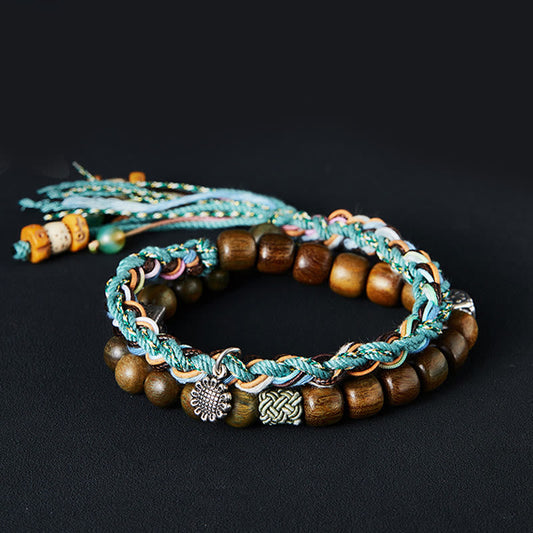 Antikes tibetisch-buddhistisches Armband mit roter Schnur, handgefertigt aus 925er Sterlingsilber und grünem Sandelholz (Bodhi-Samen).