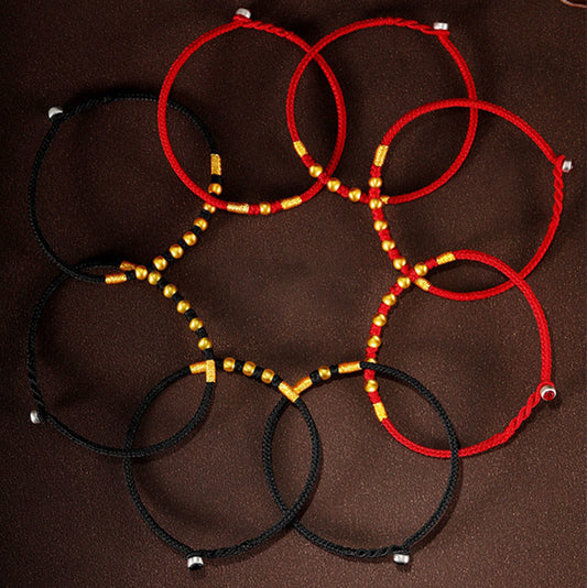 Bracelet de protection tressé à la main, orné de perles en or 999 et portant le nœud King Kong, selon la tradition bouddhiste tibétaine ancestrale du fil rouge.