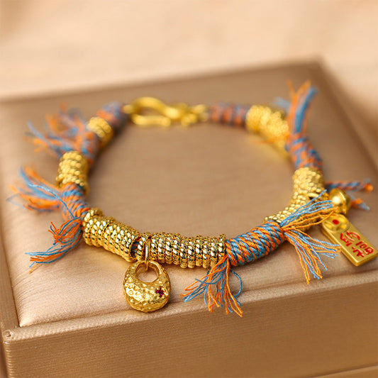 Altes tibetisches buddhistisches Armband aus rotem Seil, handgefertigt, Glücksbringer, mehrfarbig geflochten