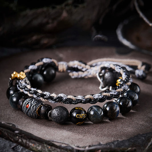 Antikes tibetisch-buddhistisches Armband mit roter Schnur, handgefertigt aus 925er Sterlingsilber, Lavastein und Adleraugen-Glücksperlen.