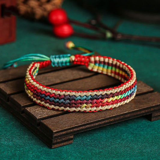 Altes tibetisch-buddhistisches Armband aus rotem Faden, handgefertigt in Regenbogenfarben, zum Schutz geflochten