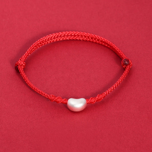 Bracelet tressé à la main en argent sterling 999, symbole de chance, inspiré de la tradition bouddhiste tibétaine du fil rouge.