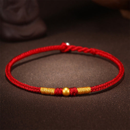 Bracelet de protection tressé à la main, orné de perles en or 999 et portant le nœud King Kong, selon la tradition bouddhiste tibétaine ancestrale du fil rouge. 