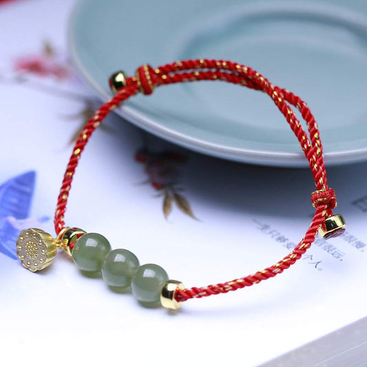 Bracelet en jade naturel, graine de lotus et fil rouge tressé, symbole de force