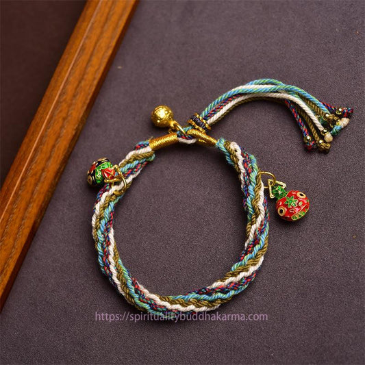 Bracelet tressé tibétain de protection fait main en or, orné d'un nœud représentant la Bête avaleuse, symbole de guérison familiale et de réincarnation 