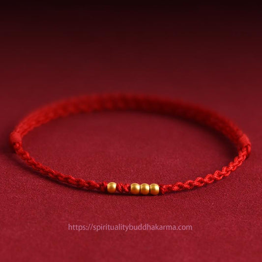 Antikes tibetisch-buddhistisches Armband aus rotem Faden mit 999er Goldperlen – geflochtenes Glücks- und Schutzarmband für Paare