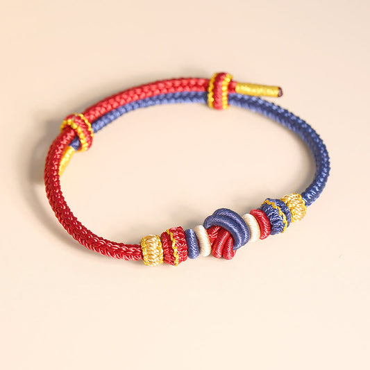 Altes tibetisch-buddhistisches Armband aus rotem Seil, zweifarbig, handgefertigt mit acht Fäden und Friedensknoten als Symbol für Glück und Verbundenheit 