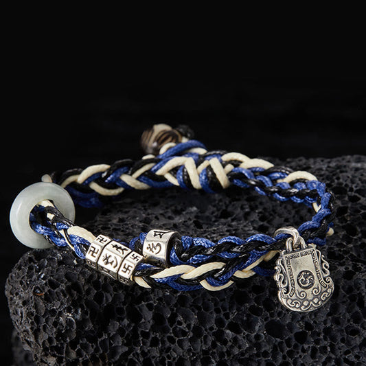 Antikes tibetisch-buddhistisches Armband mit roter Schnur, handgefertigt aus 925er Sterlingsilber mit Om Mani Padme Hum Swastika-Motiv. 
