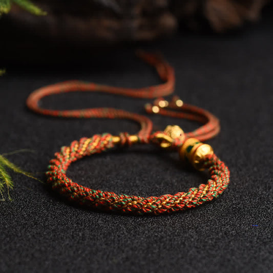 Antikes tibetisch-buddhistisches Armband aus roter Schnur mit Glücksbringer und Gebetsradperlen