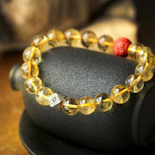 Bracelet de bénédiction en cinabre, orné d'une citrine dorée, symbole du zodiaque chinois, du Bouddha natal, de la richesse et du chakra du plexus solaire (troisième chakra).