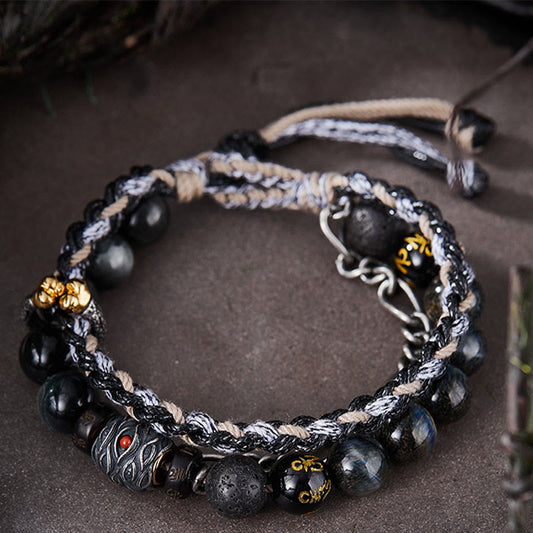 Antikes tibetisch-buddhistisches Armband mit roter Schnur, handgefertigt aus 925er Sterlingsilber, Lavastein und Adleraugen-Glücksperlen. 