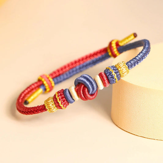 Altes tibetisch-buddhistisches Armband aus rotem Seil, zweifarbig, handgefertigt mit acht Fäden und Friedensknoten als Symbol für Glück und Verbundenheit 