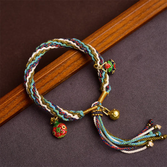 Bracelet tressé tibétain de protection fait main en or, orné d'un nœud représentant la Bête avaleuse, symbole de guérison familiale et de réincarnation 