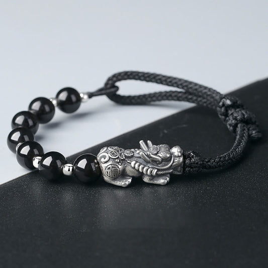 Bracelet de force en argent sterling 999, orné de perles d'obsidienne noire naturelle PiXiu et de perles de Bouddha, symbole de spiritualité et de karma.