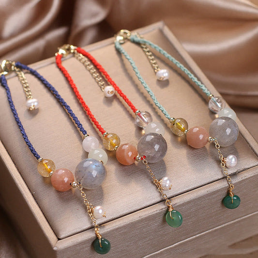 Antikes tibetisch-buddhistisches Armband mit roter Schnur, Mondstein- und Sonnensteinperlen, Friedensschnalle und Heilzauber 