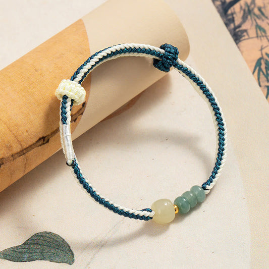 Antikes tibetisch-buddhistisches Armband mit roter Schnur, geflochten aus 925er Sterlingsilber und Hetian-Jadeperlen.