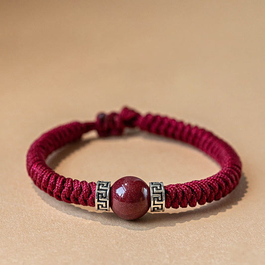 Bracelet ancien tibétain bouddhiste traditionnel en argent sterling 925 avec perles de cinabre naturel tressées à la main, orné d'une cordelette rouge. 