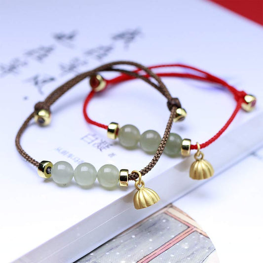 Bracelet en jade naturel, graine de lotus et fil rouge tressé, symbole de force