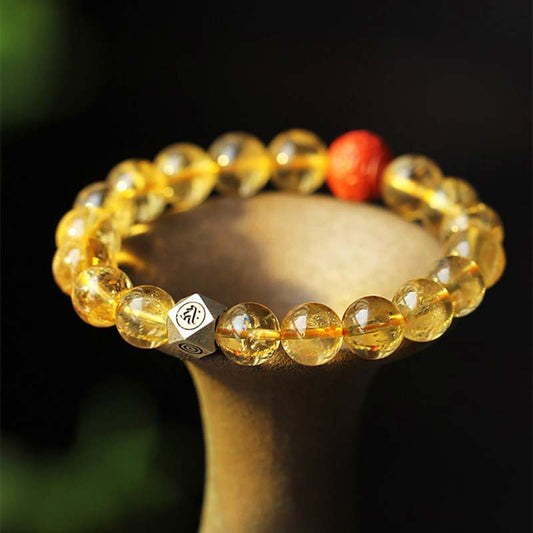Bracelet de bénédiction en cinabre, orné d'une citrine dorée, symbole du zodiaque chinois, du Bouddha natal, de la richesse et du chakra du plexus solaire (troisième chakra).