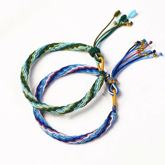 Armband mit Reinkarnationsknoten, Glücksschnur und Schutzgeflecht