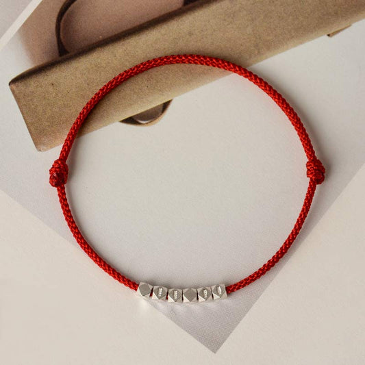Antike tibetisch-buddhistische Tradition: Armband und Fußkettchen aus 925er Sterlingsilber mit roter Flechtung 
