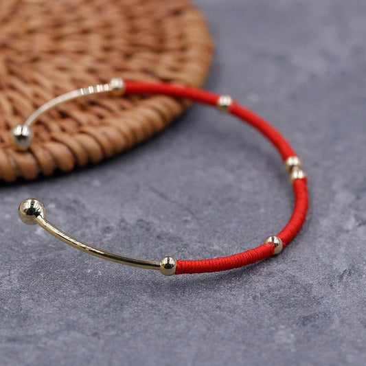 Alte tibetisch-buddhistische Tradition des roten Fadens – Armband mit Segens- und Schutzsymbolen