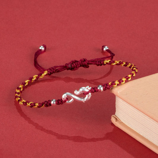 Altes tibetisch-buddhistisches Armband aus 999er Sterlingsilber mit roter Schnur – geflochtenes Armband zum Schutz vor dem Jahr des Drachen