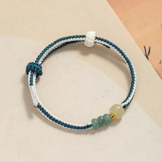 Antikes tibetisch-buddhistisches Armband mit roter Schnur, geflochten aus 925er Sterlingsilber und Hetian-Jadeperlen.