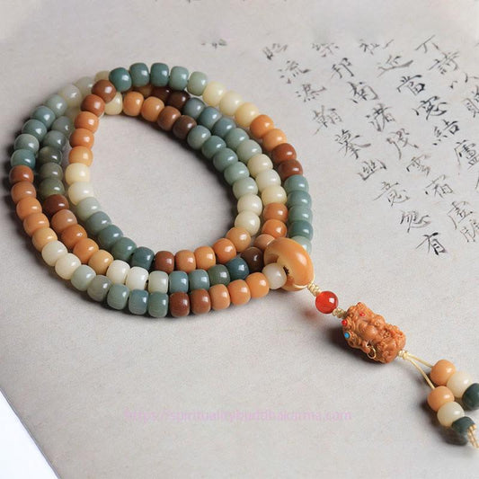 Bracelet Mala de 108 perles, symbole de spiritualité, de Bouddha et de karma, avec graine de Bodhi verte et gravure de Tara Bouddha, représentant la paix et l'harmonie.