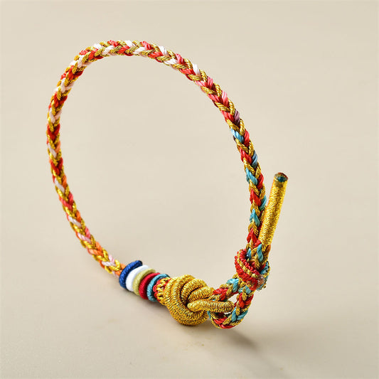 Tibetisches Knoten-Schutzarmband, handgefertigt aus farbenfrohem Gold, mit heilendem Flechtmuster 